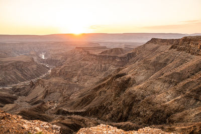 Scenic view of landscape against sky during sunset