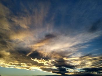 Low angle view of dramatic sky during sunset