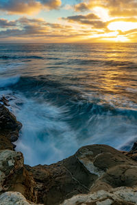 Scenic view of sea against sky during sunset