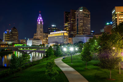 Illuminated buildings in city at night