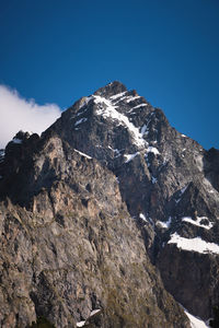 Caucasus mountains. stone slopes of mountains with pieces of snow on a sunny day, close-up