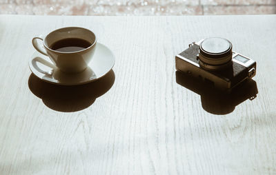 High angle view of coffee cup on table