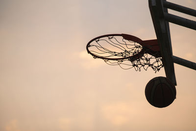 Low angle view of basketball hoop against sky