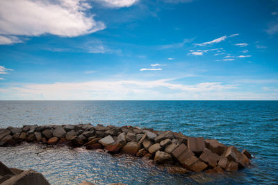 Scenic view of sea against blue sky