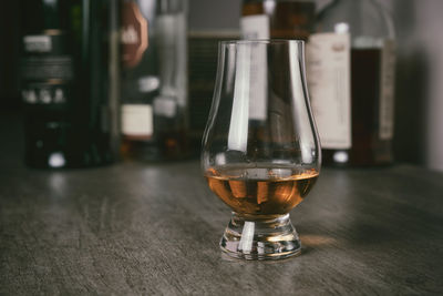 Close-up of beer glass on table