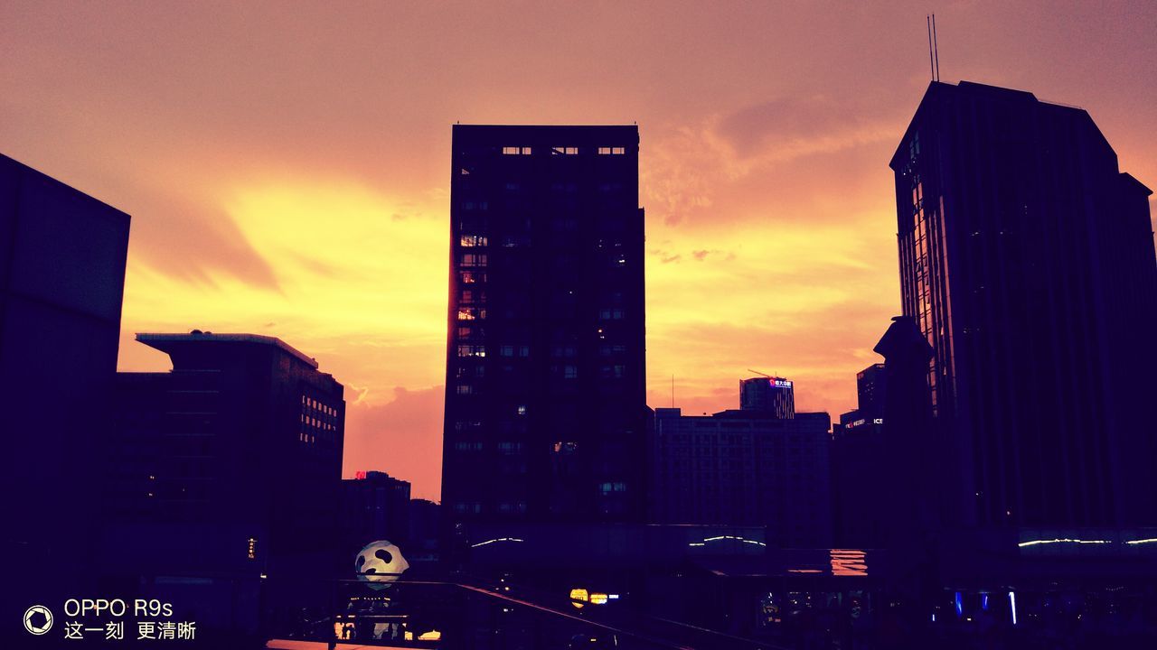 CITYSCAPE AGAINST SKY AT SUNSET