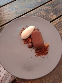 High angle view of chocolate cake in plate on table