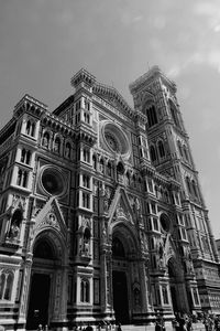 Low angle view of historical building against cloudy sky