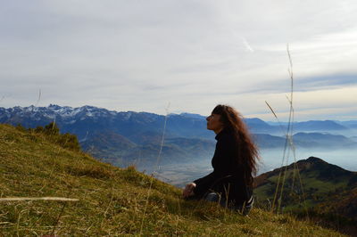 Scenic view of landscape against cloudy sky