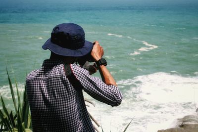 Man photographing sea