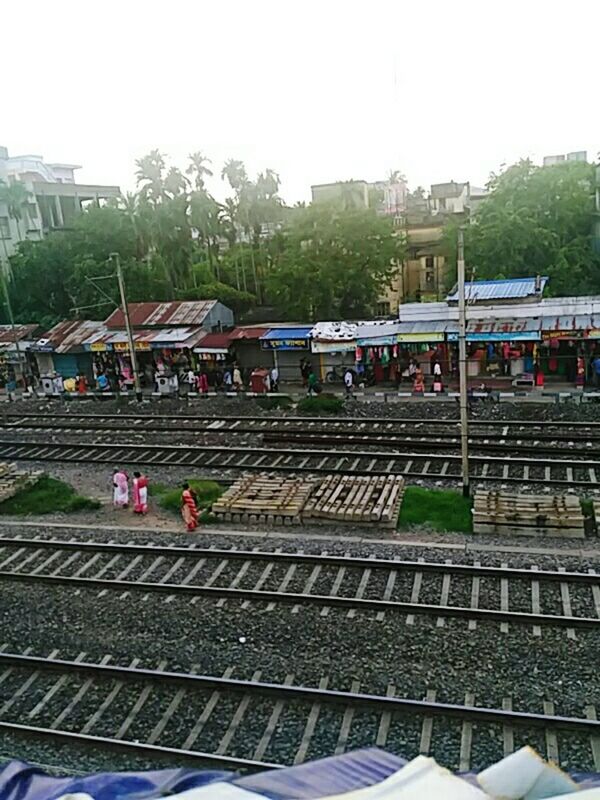 PEOPLE ON RAILROAD TRACK