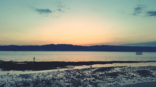 Scenic view of sea at sunset