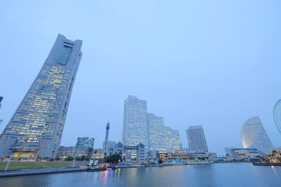 Skyscrapers in city against clear sky