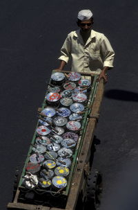 High angle view of vendor with push cart on street