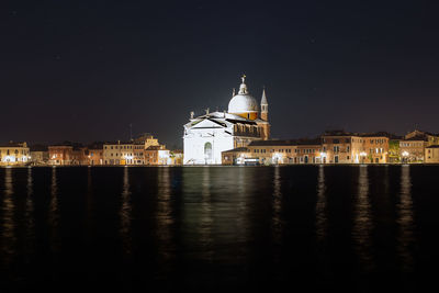 Reflection of illuminated buildings in water