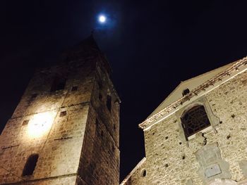 Low angle view of built structure against sky at night