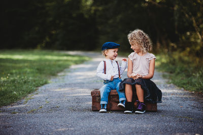 Boy sitting in park