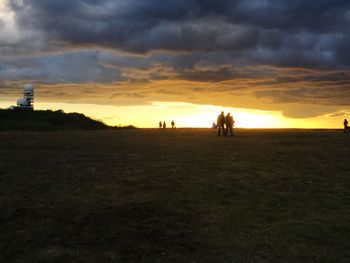 Scenic view of landscape against cloudy sky