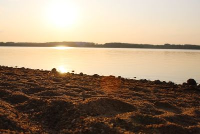 Scenic view of beach against sky during sunset