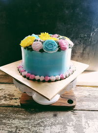 Multi colored cake on table