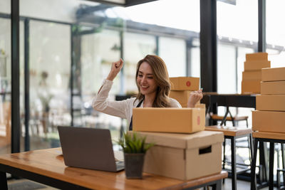 Young woman using laptop on table