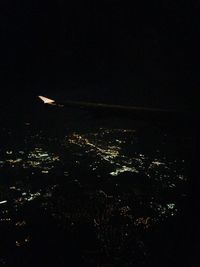 Aerial view of illuminated cityscape at night