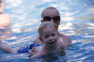 Portrait of boy swimming in pool