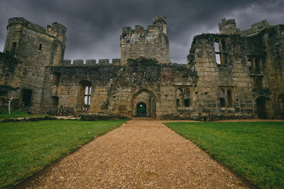 View of old building against cloudy sky