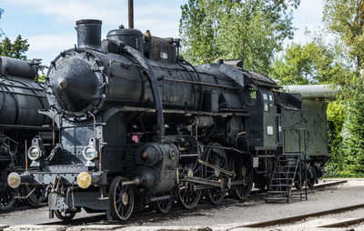 Steam train on railroad tracks