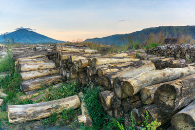 View of rocks on landscape against sky