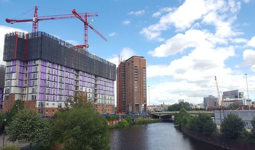 Buildings in city against sky