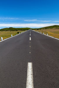 Empty road along landscape