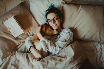 High angle view of dog lying on bed