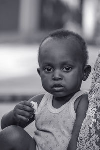 Close-up portrait of cute baby looking away