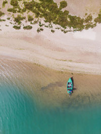 High angle view of fishing boat at beach