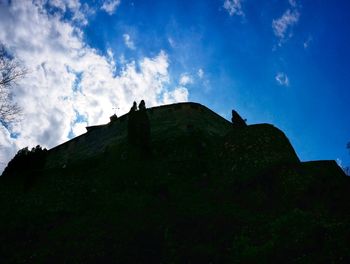 Low angle view of built structure against blue sky