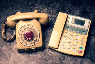 High angle view of old telephone on table