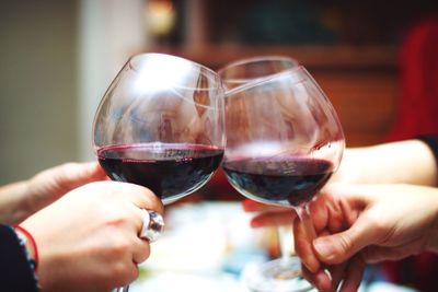 Close-up of hand holding glass of wine