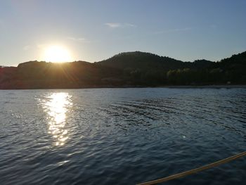 Scenic view of lake against sky during sunset