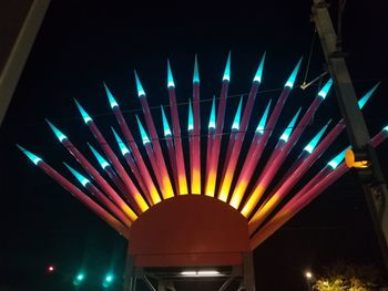 Low angle view of illuminated lights at night