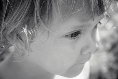 Close-up portrait of a girl looking away