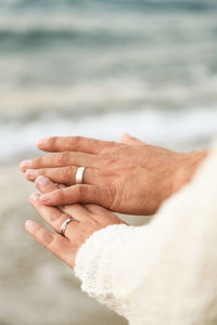 Cropped image of couple hands