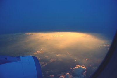 Aerial view of landscape against cloudy sky