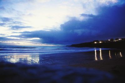 Scenic view of sea against cloudy sky