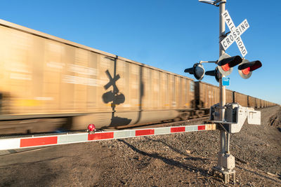 Low angle view of train on railroad track against sky