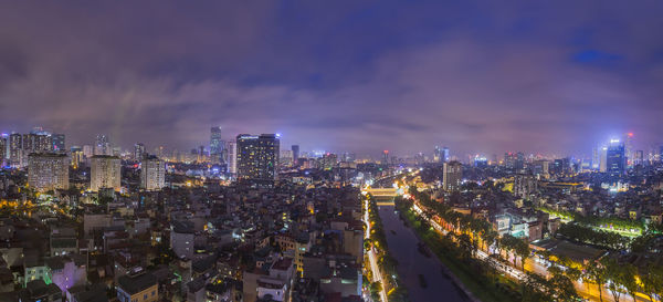 High angle view of illuminated city buildings at night