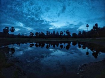 Scenic view of lake against sky at dusk