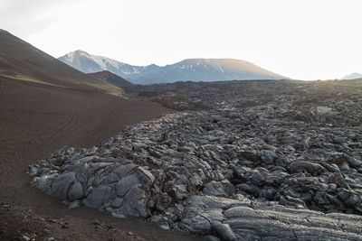 Scenic view of arid landscape against sky