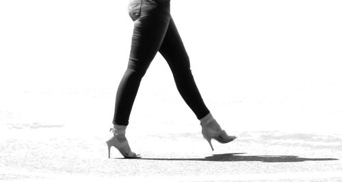 Low section of woman standing on tiled floor