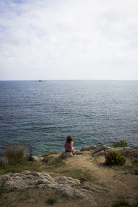 Rear view of man standing on beach